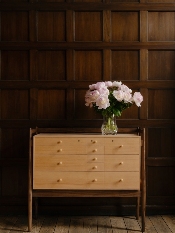 The Silverware Cabinet's distinctive organic frame is crafted from walnut, while the drawer unit is made from Oregon pine.