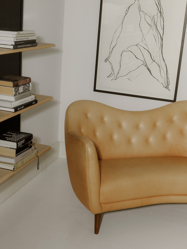 The 46 Sofa with walnut legs upholstered with 'Vegetal' leather.