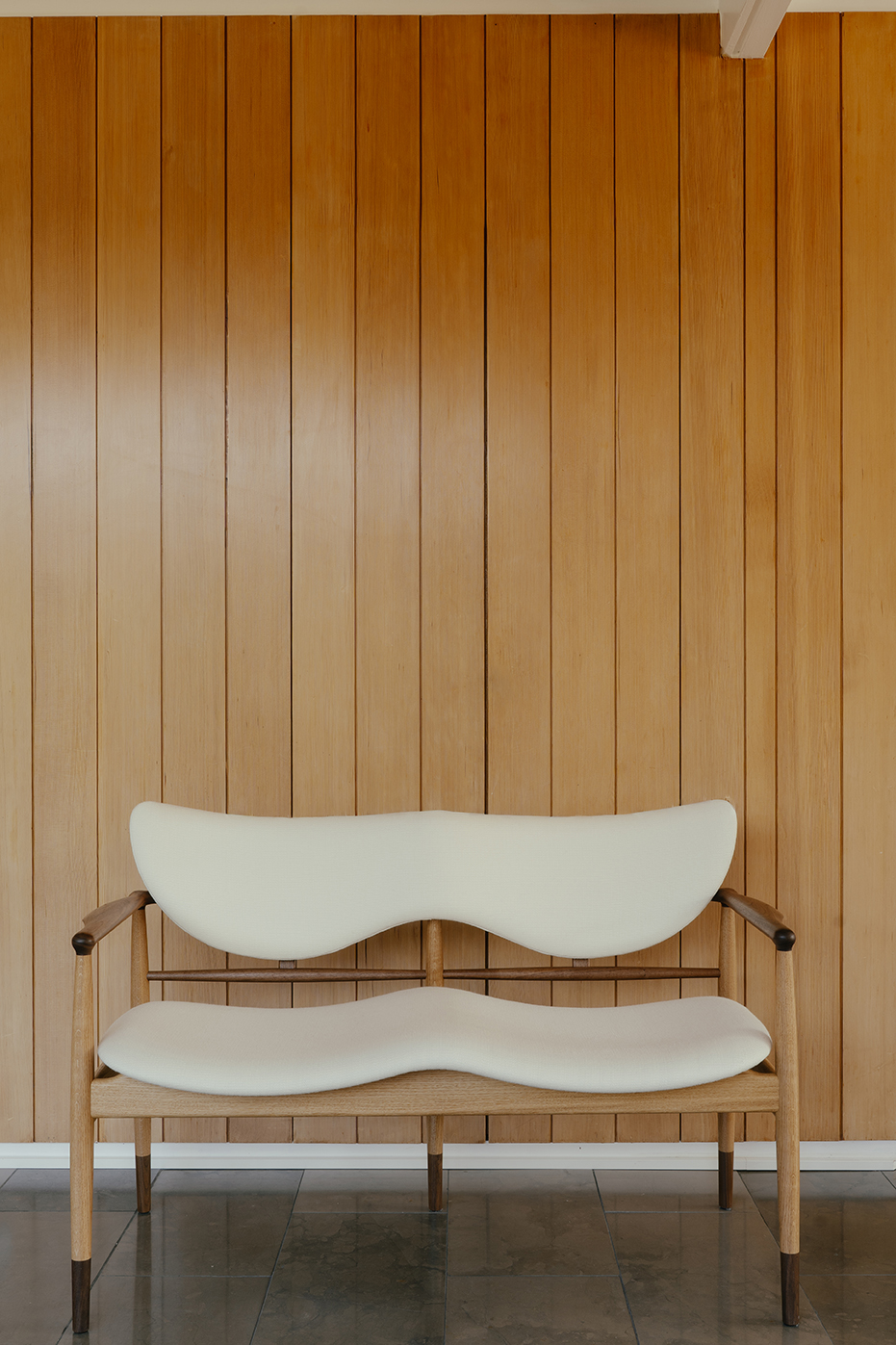 The 48 Sofa Bench in walnut and oak upholstered with Fuse in the colour '0111'.