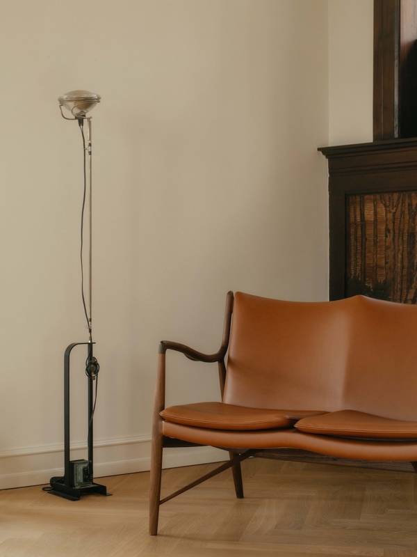 The 45 Sofa in walnut with 'Elegance' leather in the color 'Walnut'.